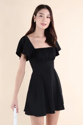 NEVEA RUCHED FLUTTER SLEEVE DRESS IN BLACK